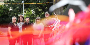Jenni Di Trani,Jeanette Richardson John Lawrance,Helen Dawson and Brian Cherrie tie ribbons to the fence outside St Patrick’s Cathedral in Melbourne.