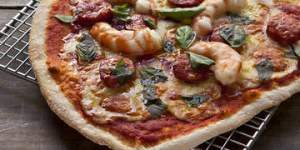 Chorizo and prawn pizza (L) and Zucchini,green olive,mint and feta pizza (R). Frank Camorra PIZZA recipes for Spectrum and Good Food. Photographed by Marina Oliphant. The Sydney Morning Herald. March 8,2013.