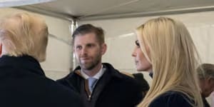 Then-president Donald Trump watches video monitors showing the crowd gathered on the Ellipse on the morning of the riots,before he spoke. At right are his son Eric and daughter Ivanka.