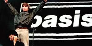 Noel and Liam Gallagher salute the crowd at the first of two sell-out concerts at Loch Lomond in Scotland.
