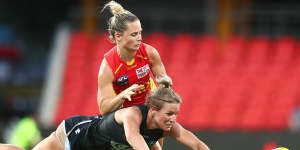 Katie Loynes dives for the ball. 