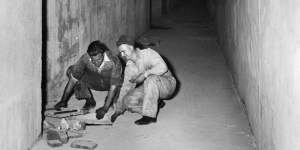 Workers in the tunnel beneath the Royal Melbourne Hospital pictured in 1940.