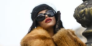 Big sunglasses,big fur,big attitude. The mob wife trend seen at Paris Fashion Week in September.