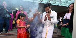 The family taking part in a smoking ceremony by Gangulu Elders at the start of the festival.