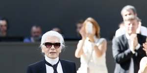 Karl Lagerfeld acknowledges applause after the presentation of Chanel's Haute Couture Fall/Winter 2017/2018 fashion collection,in Paris.