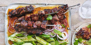 Coconut and lemongrass pork skewers with chilli-vinegar sauce.