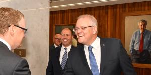 Prime Minister Scott Morrison and Treasurer Josh Frydenberg meet RBA governor Philip Lowe at the Reserve Bank on May 22. 