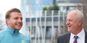 Jason Cummings with Socceroos coach Graham Arnold on Tuesday.
