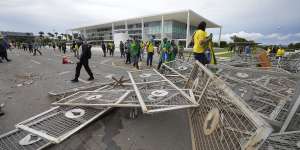 Protesters,supporters of Brazil’s former president Jair Bolsonaro,broke through police barricades to storm the Planalto Palace in Brasilia.