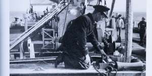 Lieutenant Lyle Miller in HMS Sandcroft,laying a refuelling cable for ships following D-Day in June 1944.