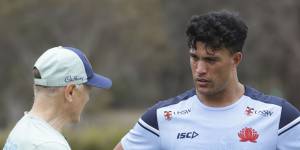 Joseph Suaalii chatting to coach Joe Schmidt in camp with the Wallabies.