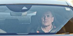 Prince William,left,drives away from the London Clinic on January 18.