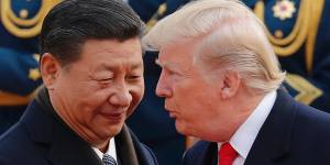 US President Donald Trump,right,chats with Chinese President Xi Jinping during a welcome ceremony at the Great Hall of the People in Beijing earlier this month.
