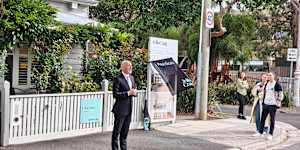 Jellis Craig Richmond auctioneer Luke Schickerling calls for bids at 266 Mary Street.
