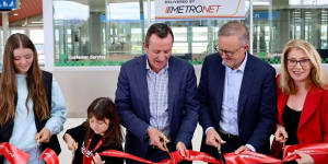 Premier Mark McGowan (centre),PM Anthony Albanese and WA Transport Minister Rita Saffioti cut the ribbon at the opening of Perth’s Metronet Airport Link on Sunday.
