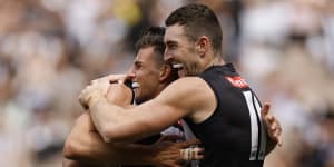 Happy days:Nick Daicos and Dan McStay celebrate a goal,as the Magpies remain unbeaten to start the new season.