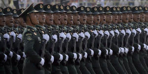 Soldiers from China's People's Liberation Army (PLA) march in formation during a parade to commemorate the 70th anniversary of the founding of Communist China in Beijing,Tuesday,Oct. 1,2019. Trucks carrying weapons including a nuclear-armed missile designed to evade U.S. defenses rumbled through Beijing as the Communist Party celebrated its 70th anniversary in power with a parade Tuesday that showcased China's ambition as a rising global force. (AP Photo/Mark Schiefelbein)