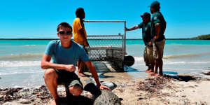 Michael,then 16,helps Nyul-Nyul rangers trap a croc.