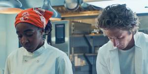 Ayo Edebiri as Sydney and Jeremy Allen White as Carmy in their kitchen in The Bear.