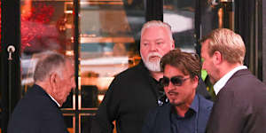 Kyle Sandilands was spotted dining with John Singleton and John Ibrahim days after settling his court case with ARN.