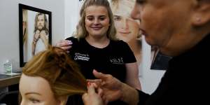 Hairdressing apprentice Lily Wickett,17,has no regrets about leaving school before completing year 10.