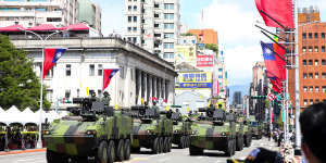 Tanks pass in front of the Presidential Office during the National Day celebration in Taipei in October.