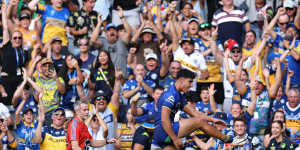 Blaize Talagi celebrates a try on his NRL debut.