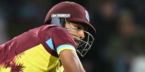 Pooran reaches for the ball