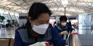 Disinfection spraying anti-septic solution at Seoul's Incheon Airport. The coronavirus outbreak has dented travel demand in the Asia Pacific. 