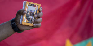 A member of the Tigrayan-Ethiopian community in Pretoria,South Africa,holds a booklet titled"Nobel Prize Licence to Kill"during a protest against the conflict in Ethiopia's Tigray region.