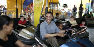 Barack Obama bumps Michelle Obama at the 2007 Iowa State Fair shortly before his win in the state that kicked off his successful presidential bid.