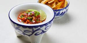 Ceviche rojo with corn chips.