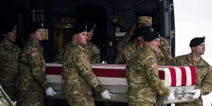 An Army carry team moves the transfer case containing the remains of US Army Sergeant Kennedy Ladon Sanders. Sanders was one of the three US troops killed in the drone attack.