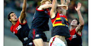 Troy Broadbridge (centre) in action for the Demons.