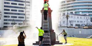 The St Kilda statue is cleaned on Wednesday morning.