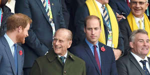 From left:Prince Harry,his late grandfather Prince Philip,and Prince William attend the Rugby World Cup final match between New Zealand and Australia in London in 2015. 