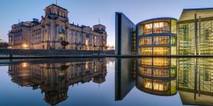 The famous Reichtsag and the Paul-Loebe-Haus at the river Spree in Berlin.