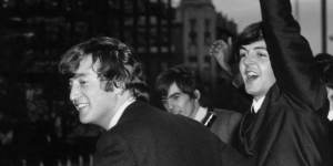 The Beatles wave to the fans from the first floor balcony of the Southern Cross Hotel,Melbourne.