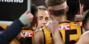 Alastair Clarkson speaks to his players during the clash with Sydney last month.