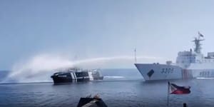 A Chinese ship fires water cannon at a Philippines vessel.