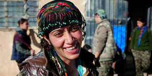 Nishtiman Nishtiman,a 26-year-old YPG fighter,takes a break from a three-day push to liberate eight villages in north-eastern Syria. 