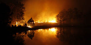 Hillville fire reflects on water during the out-of-control fire on Tuesday evening.