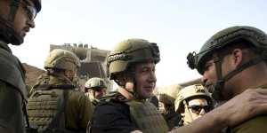 Israel Prime Minister Benjamin Netanyahu visiting soldiers at the Gaza Strip on Sunday.