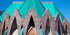 The roof of the Basilique Sainte-Anne in the colourful city of Brazzaville is crowned with glazed,malachite-green roof tiles.