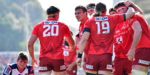 The Sunwolves celebrate a try against the Melbourne Rebels in 2020.