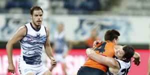 Toby Greene tries to fend off Patrick Dangerfield.