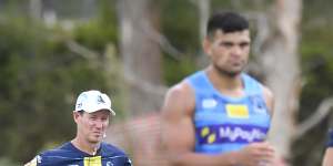 Justin Holbrook watches on as David Fifita trains with the Titans during last year’s preseason.