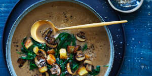 Lighten up:Brown mushroom and spinach soup with crunchy croutons.