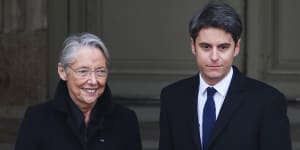 Newly appointed French Prime Minister Gabriel Attal is welcomed by outgoing French prime minister Elisabeth Borne.