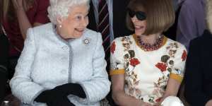 Queen Elizabeth sits next to fashion editor Anna Wintour during a show at London Fashion Week.